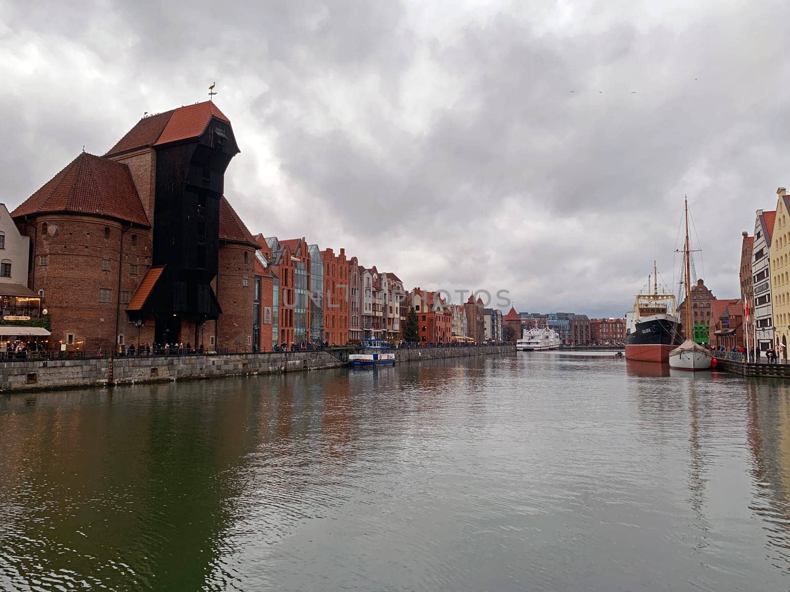The historical Brama Żuraw black building on the Nowa Motlawa river in Gdansk in Poland