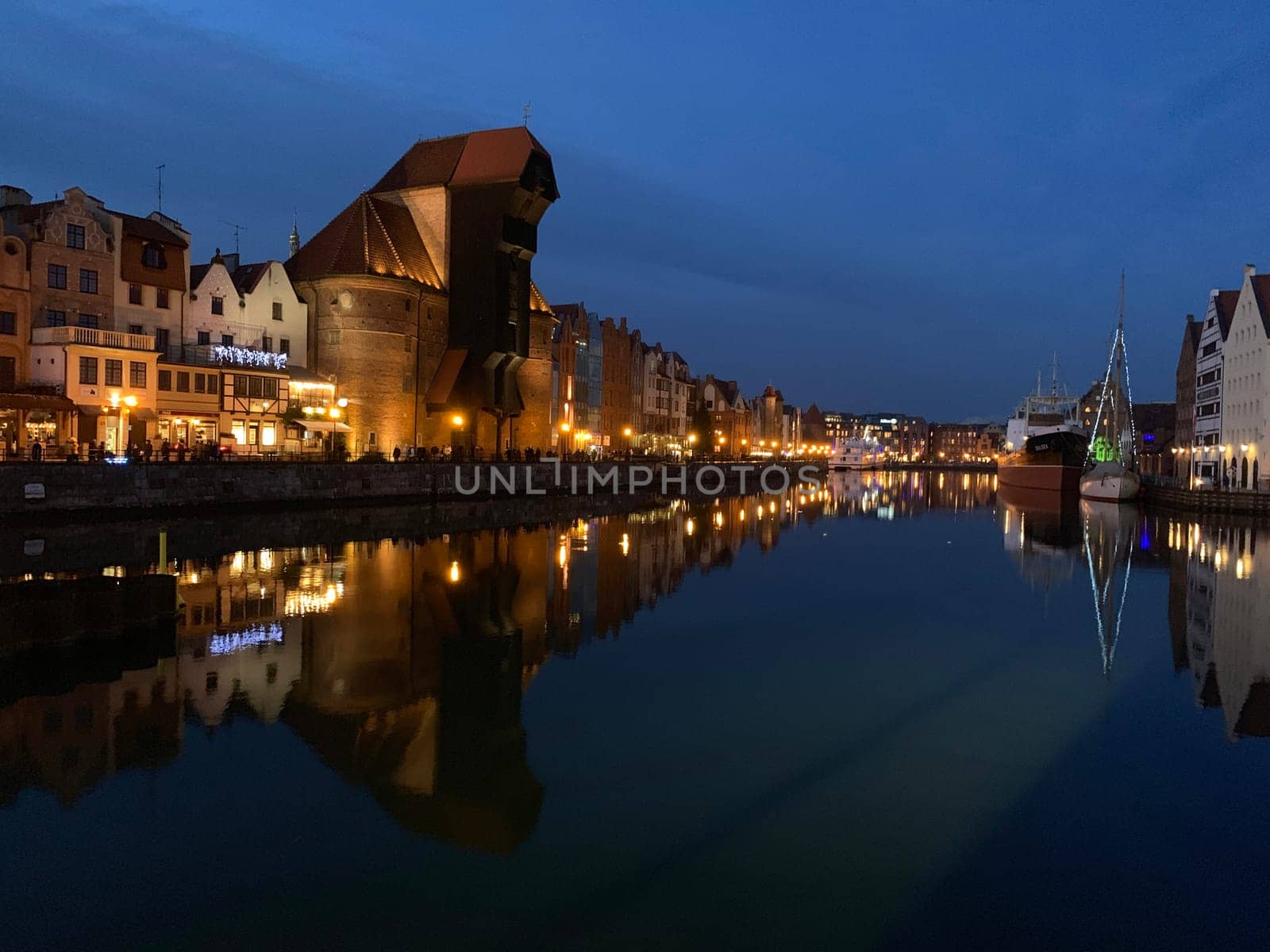 Gdansk channels with Brama Żuraw during a clear sky night in Poland