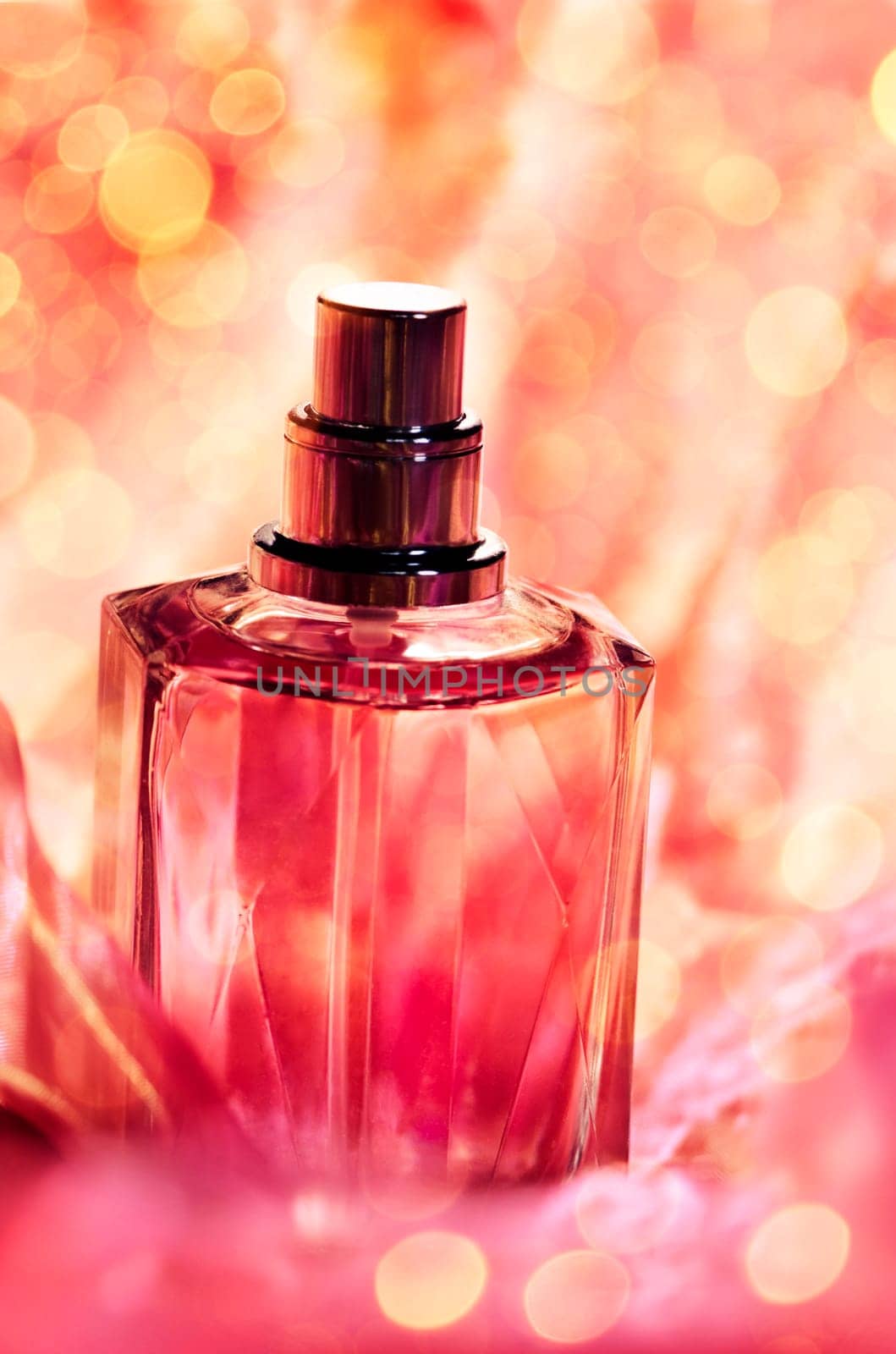 Parfume bottle with sparkling background