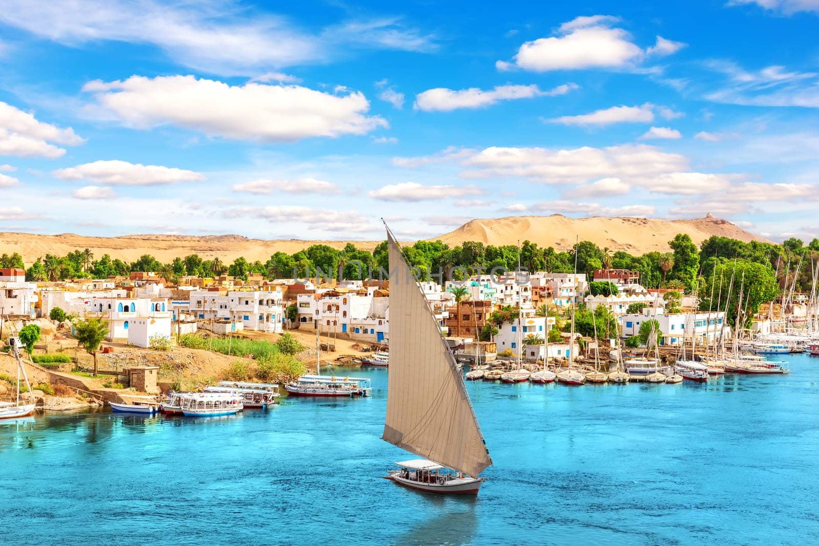 Traditional buildings of Aswan, the Nile and sailboats, Egypt.