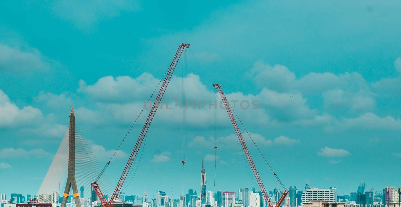 Panorama scenic of Construction Skyline with Blue sky Background and crane on construction Site. Cityscape Urban Facility