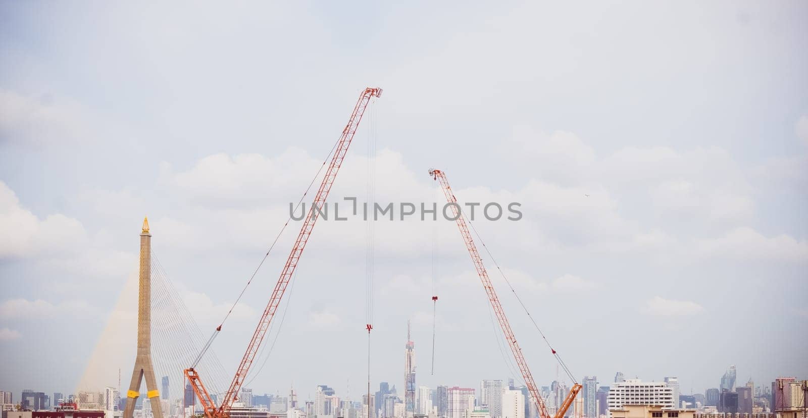 Panorama scenic of Construction Skyline with Blue sky Background and crane on construction Site. Cityscape Urban Facility