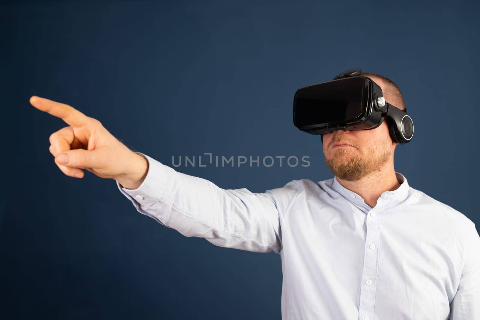 Metaverse digital cyber world technology. Businessman with VR glasses using AR augmented reality NFT, futuristic lifestyle concept