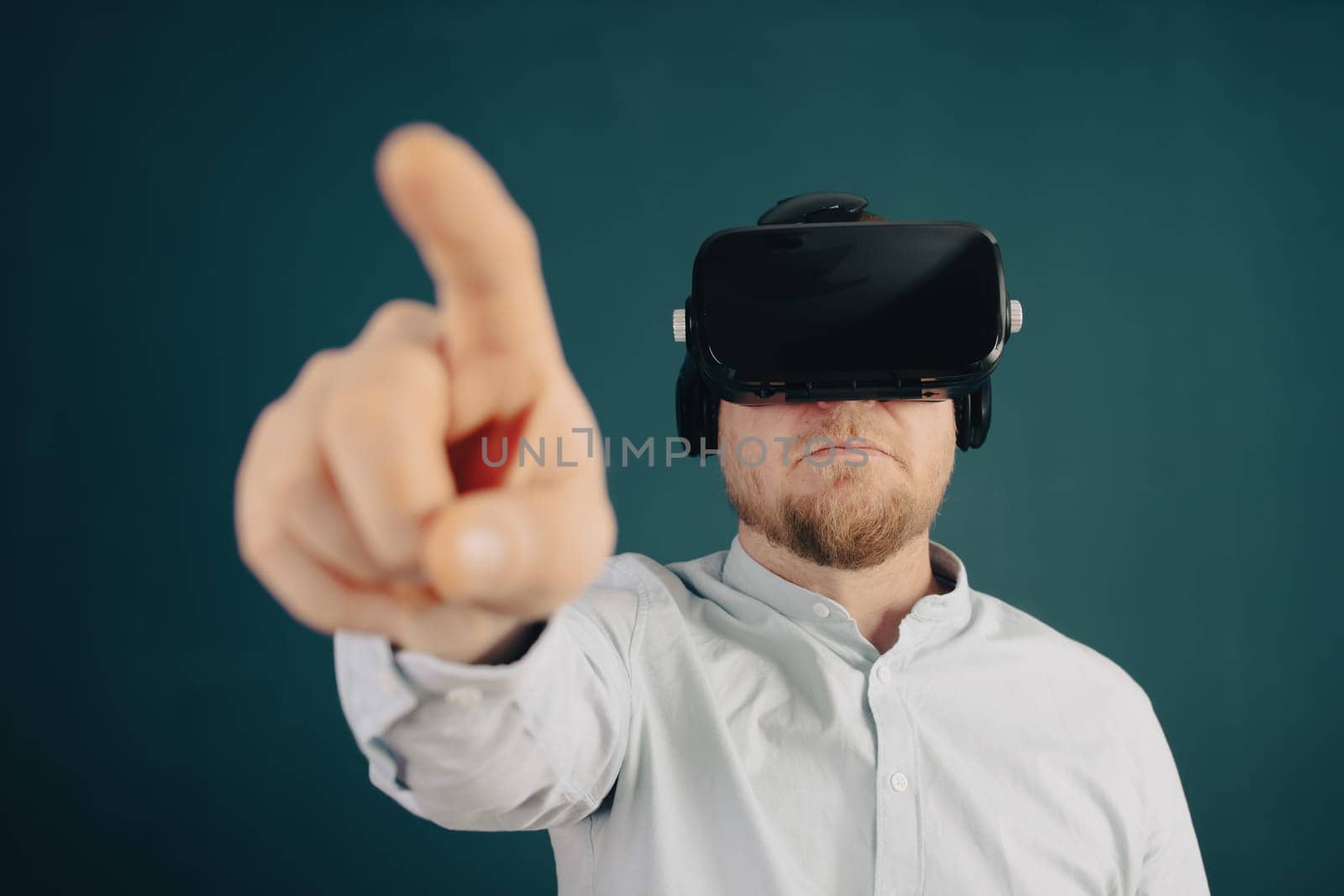 Metaverse digital cyber world technology. Businessman with VR glasses using AR augmented reality NFT, futuristic lifestyle concept