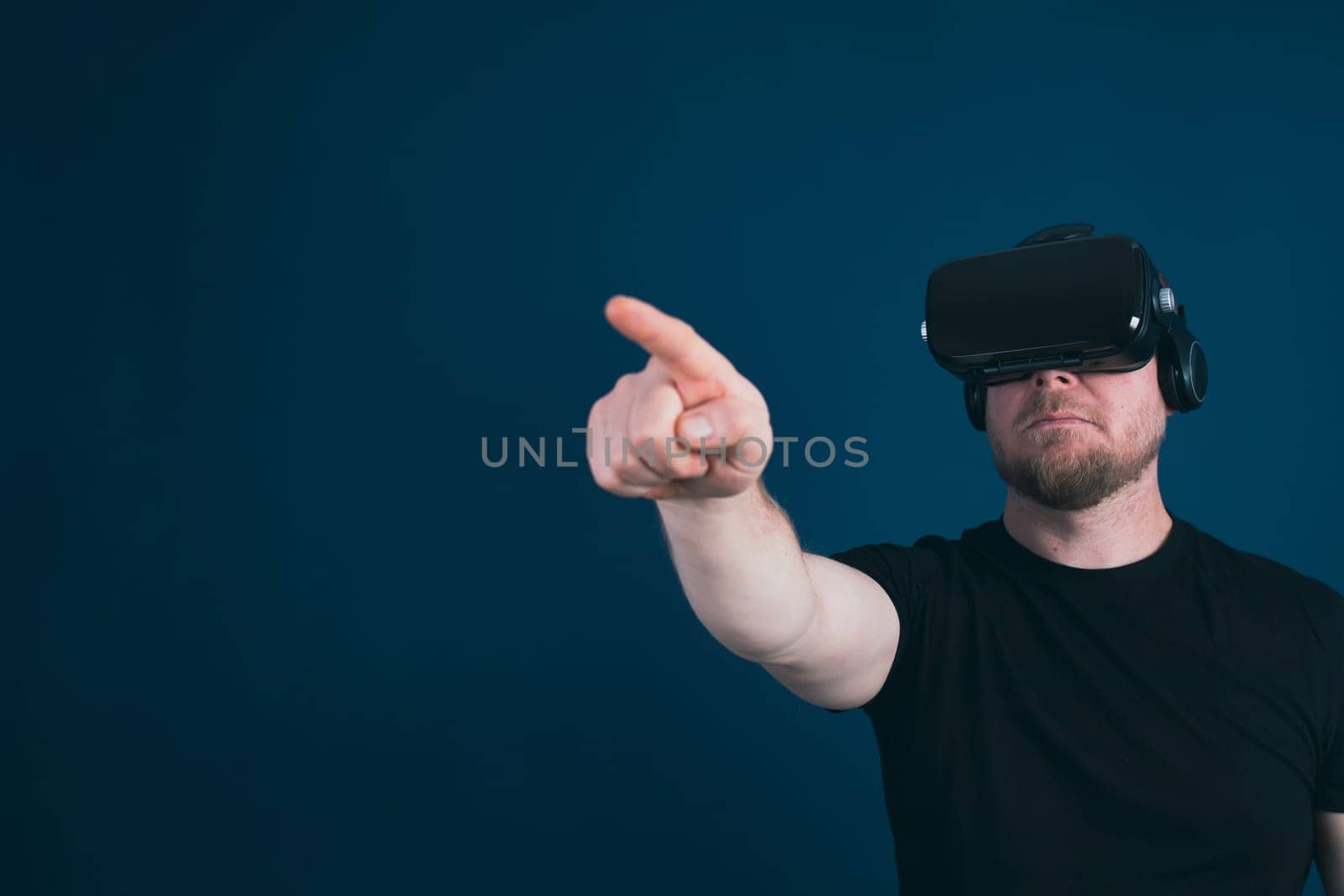 Metaverse digital cyber world technology. Man with VR glasses using AR augmented reality entertainment. NFT, game, futuristic lifestyle.