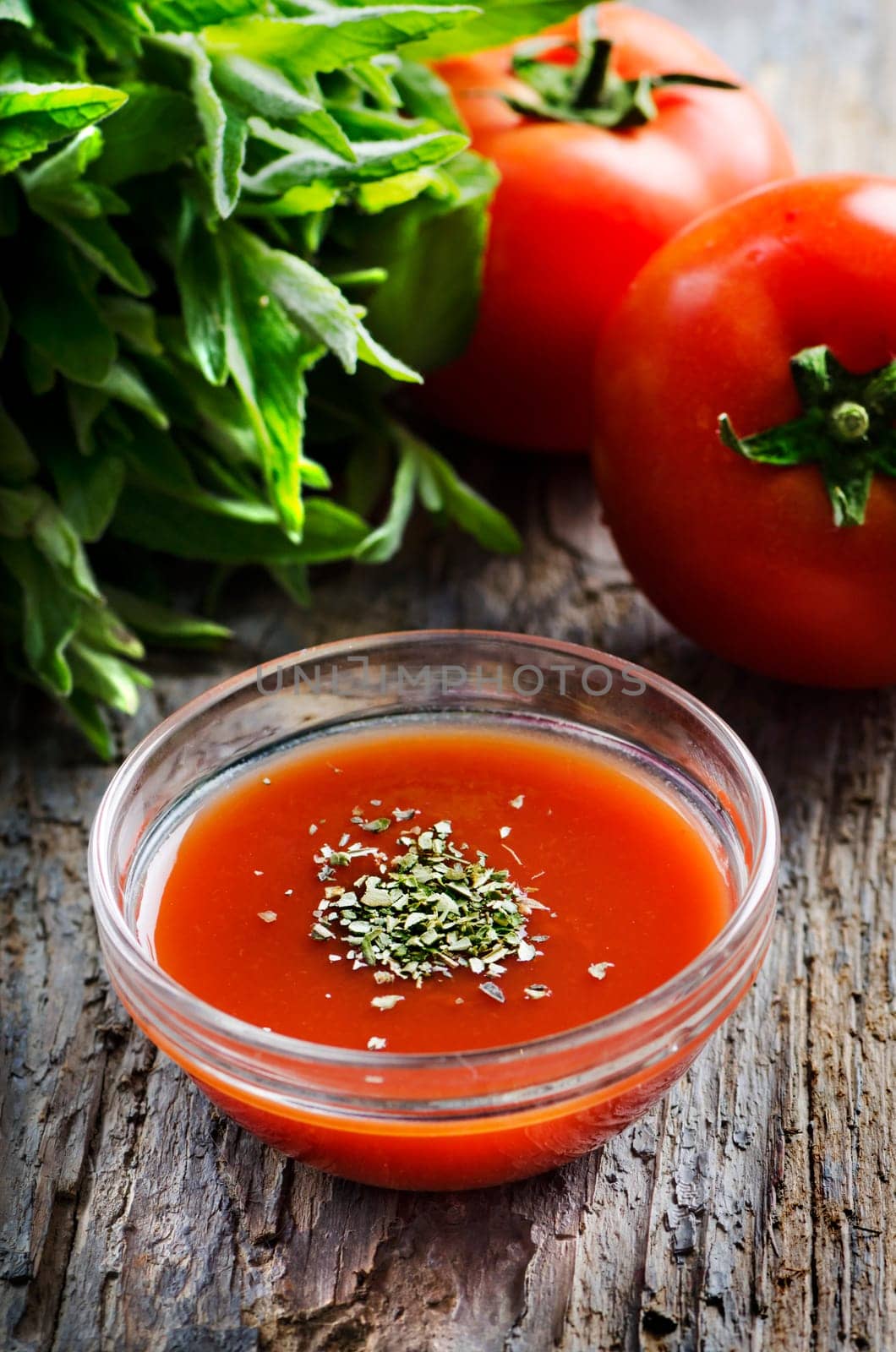 Tomato sauce on rustic wooden table