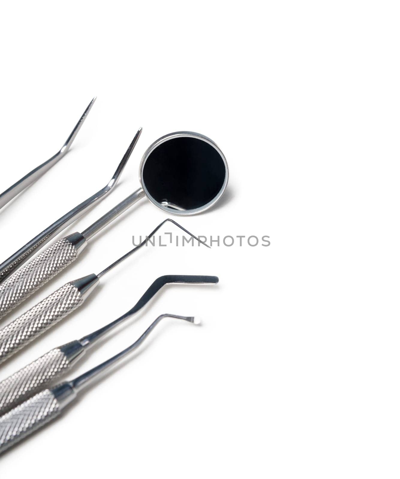 Dental instruments closeup isolated over white