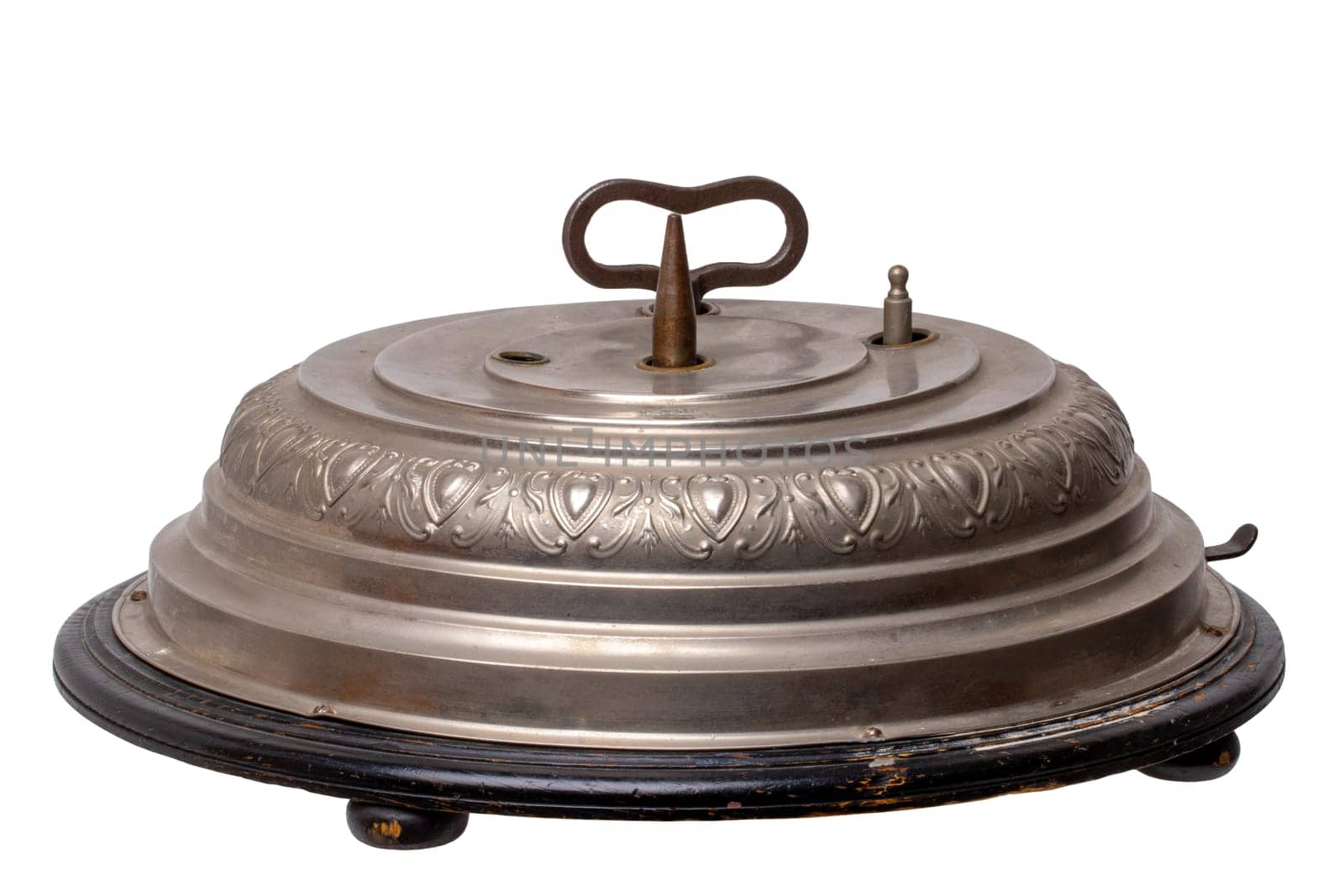 Antique original german Christmas tree stand (1902) with mechanical music box with 2 Christmas carols and turning mechanism for the Christmas tree. Clipping path. Isolated on white.
