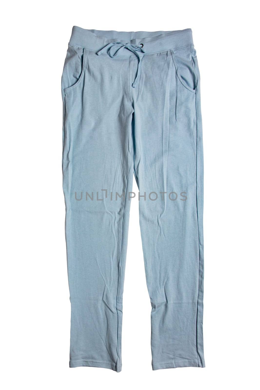 Sweat pants isolated. Close-up of womans fashionable blue casual trousers or jersey trousers isolated on a white background. Jogging outfit for workout. Clipping path.