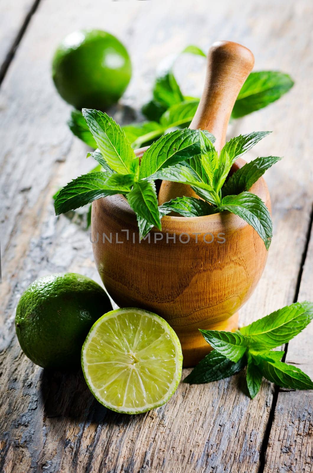Mojito ingredients on rustic wooden table