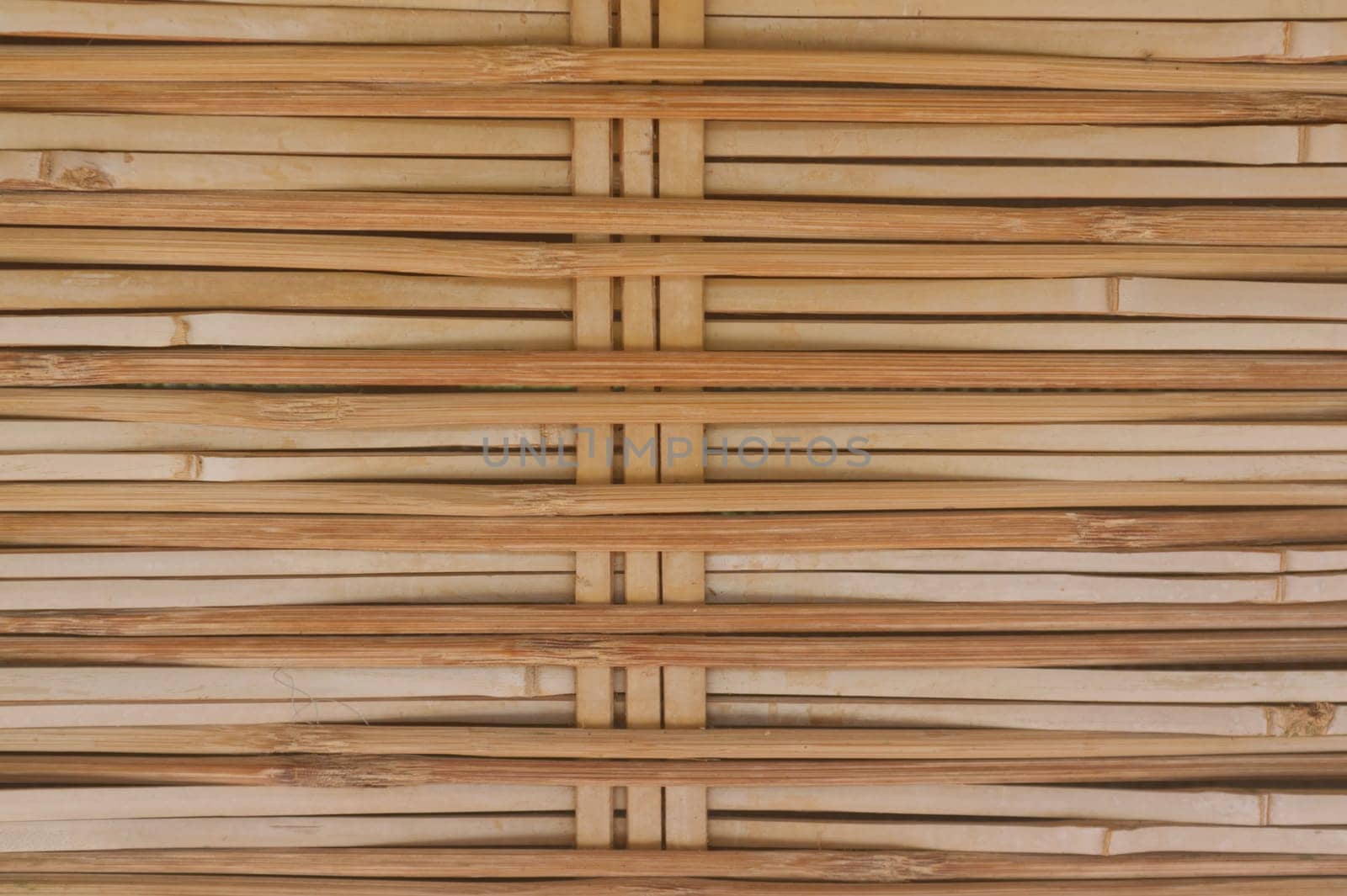 Old brown tone bamboo plank fence texture .