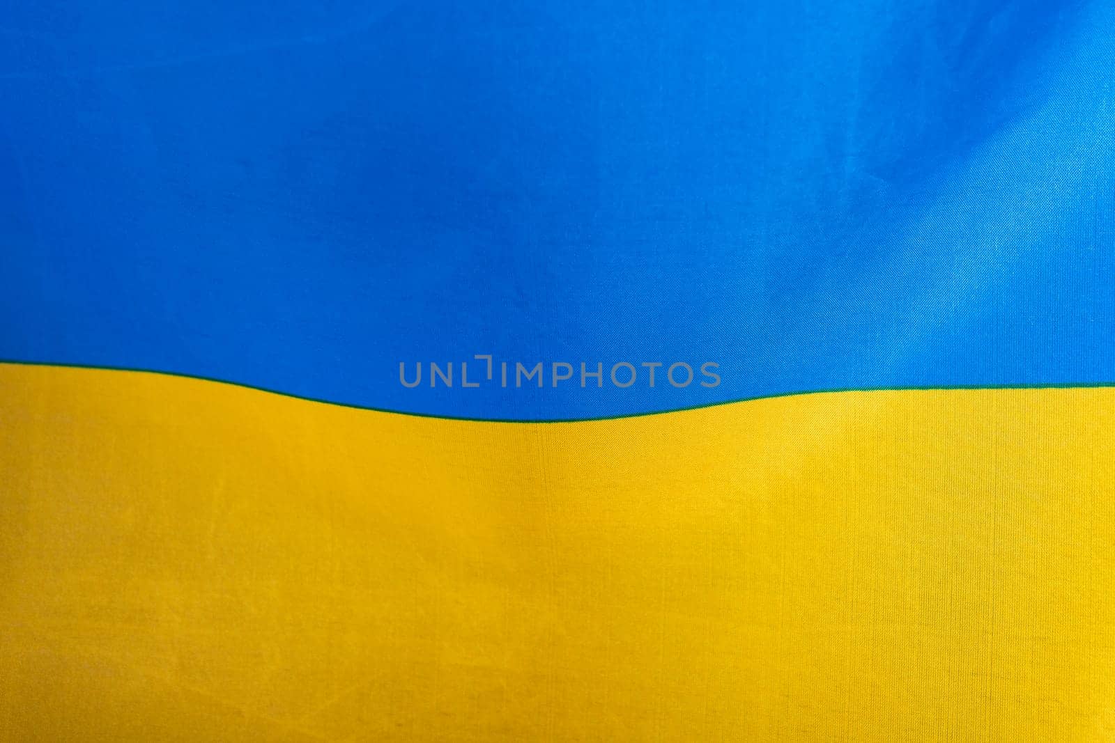 Flag of Ukraine, UA. Blue and yellow colors. Close up shot, background