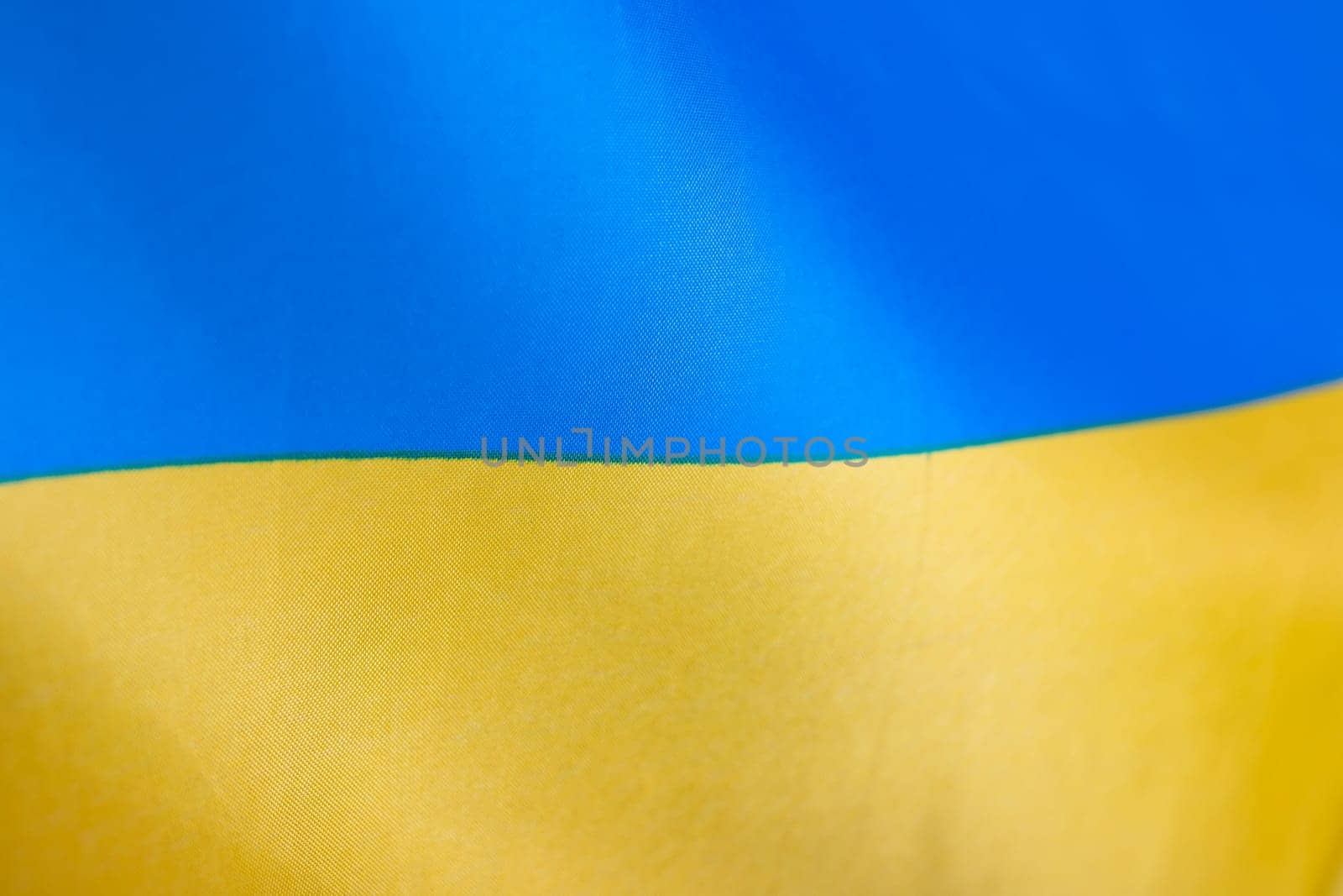 Flag of Ukraine, UA. Blue and yellow colors. Close up shot, background