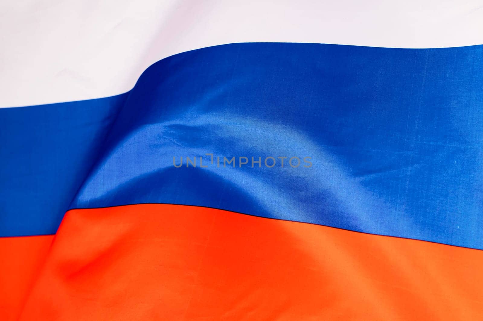 Waving colorful national flag of russia. Russian-Ukrainian conflict concept