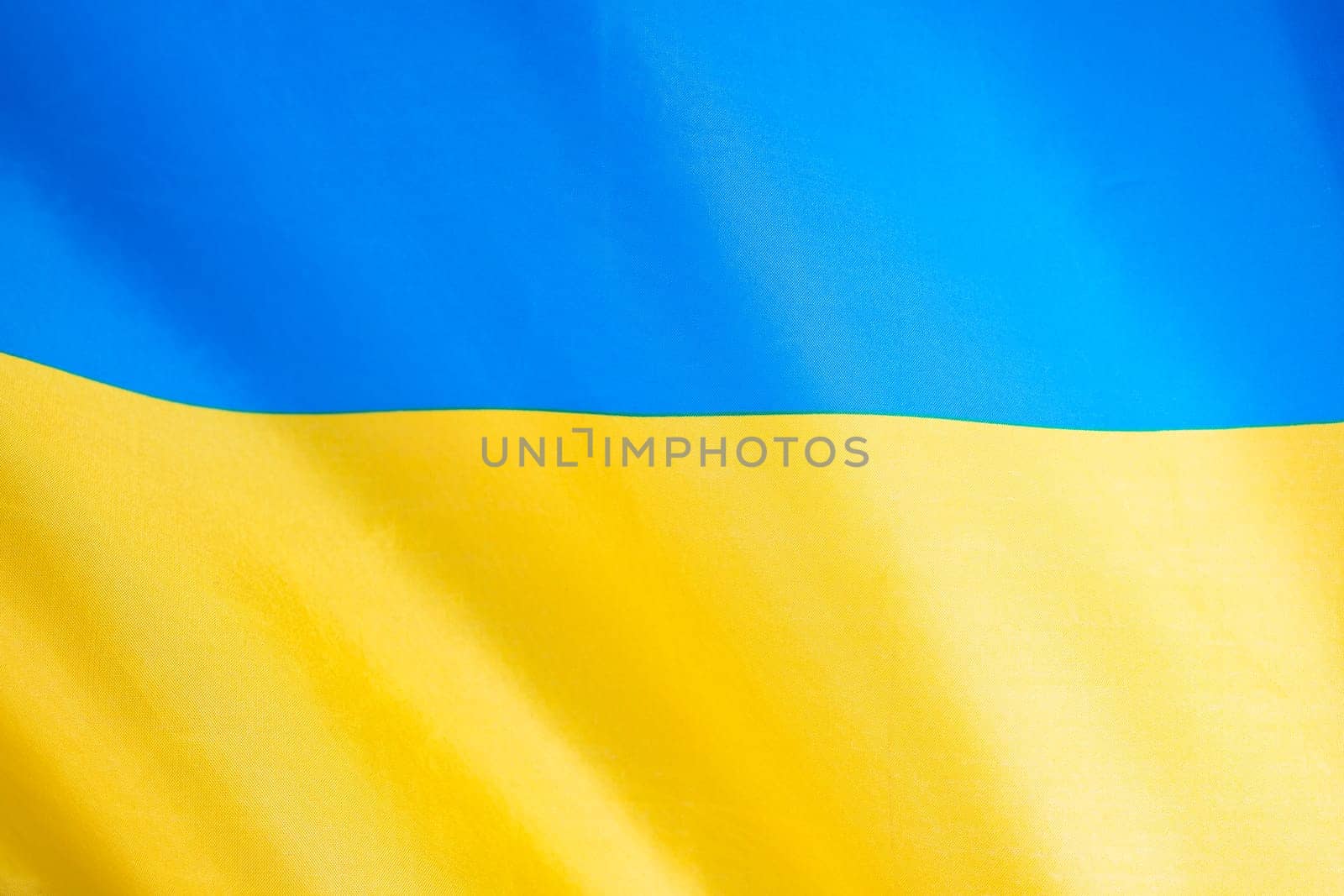 Flag of Ukraine, UA. Blue and yellow colors. Close up shot, background