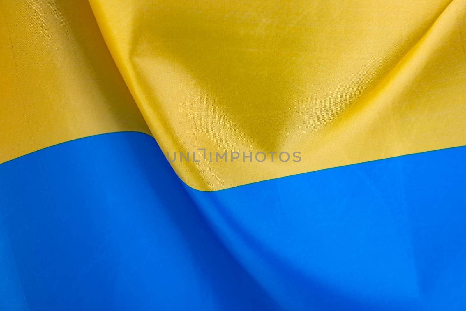 Flag of Ukraine, UA. Blue and yellow colors. Close up shot, background