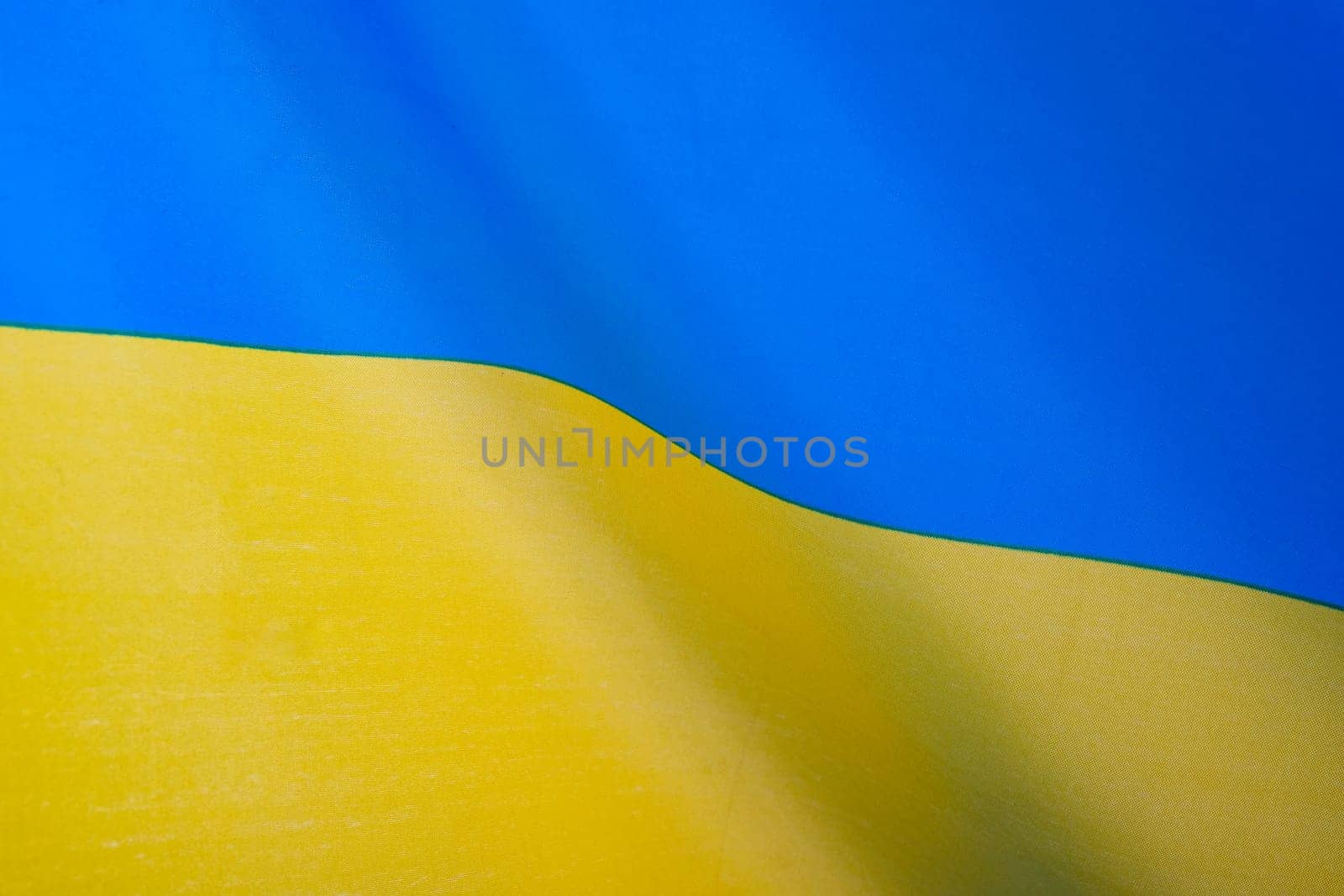 Flag of Ukraine, UA. Blue and yellow colors. Close up shot, background
