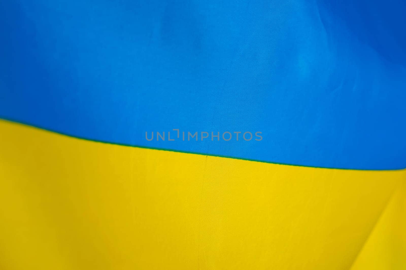 Flag of Ukraine, UA. Blue and yellow colors. Close up shot, background