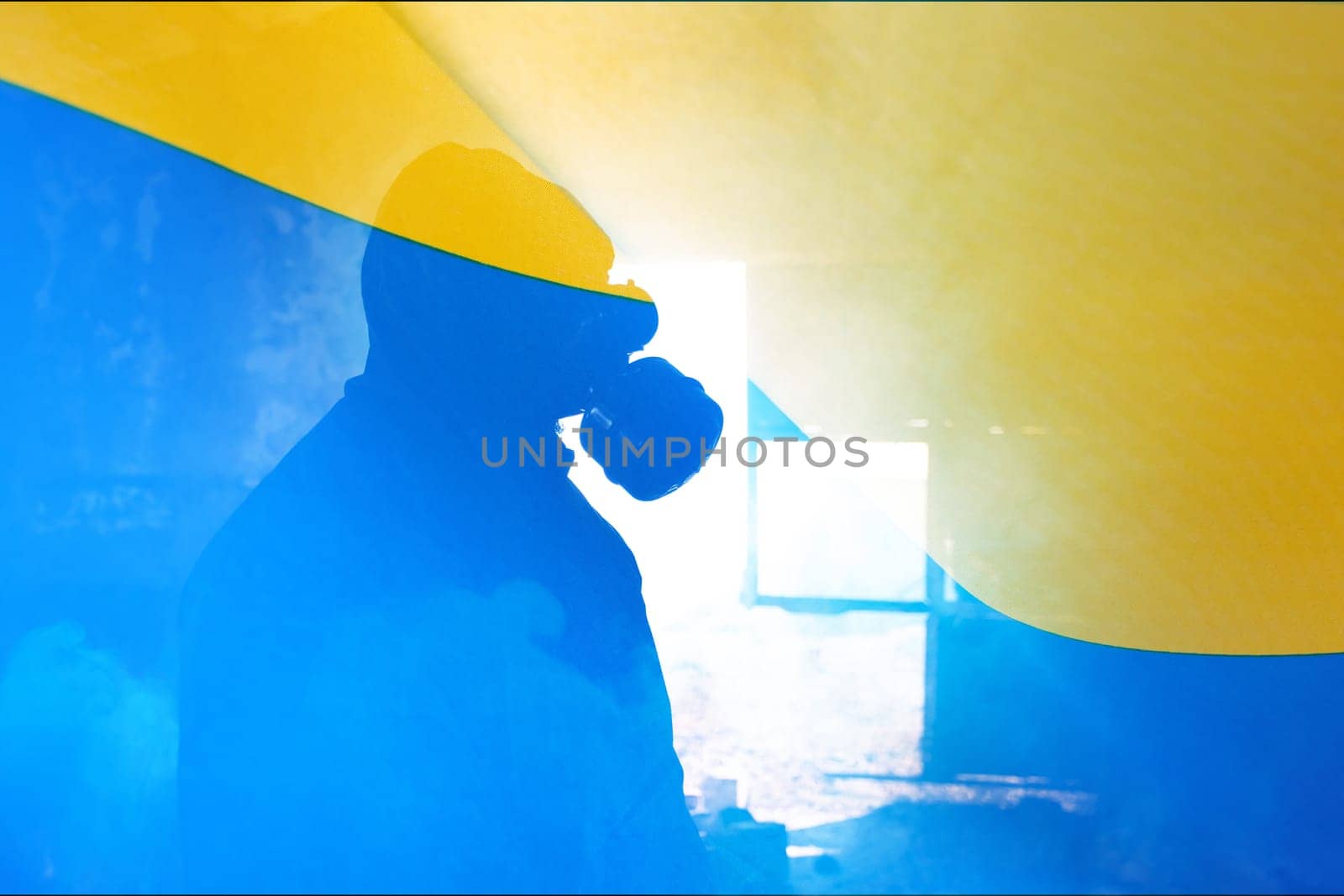 Concept of Russian forces captured the Cernobyl power plant. Person with gas mask and the Ukrain flag