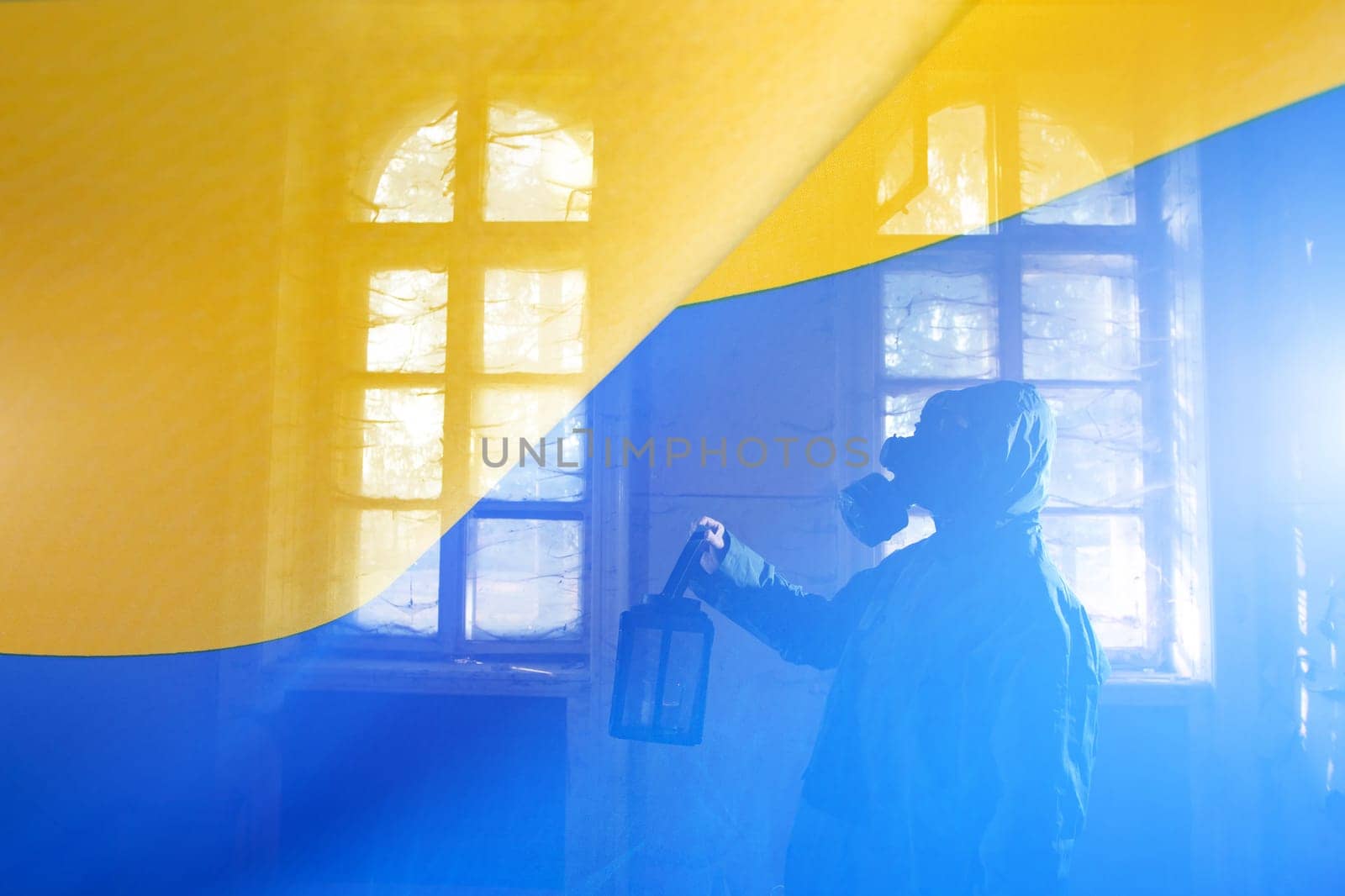 Concept of Russian forces captured the Cernobyl power plant. Person with gas mask and the Ukrain flag