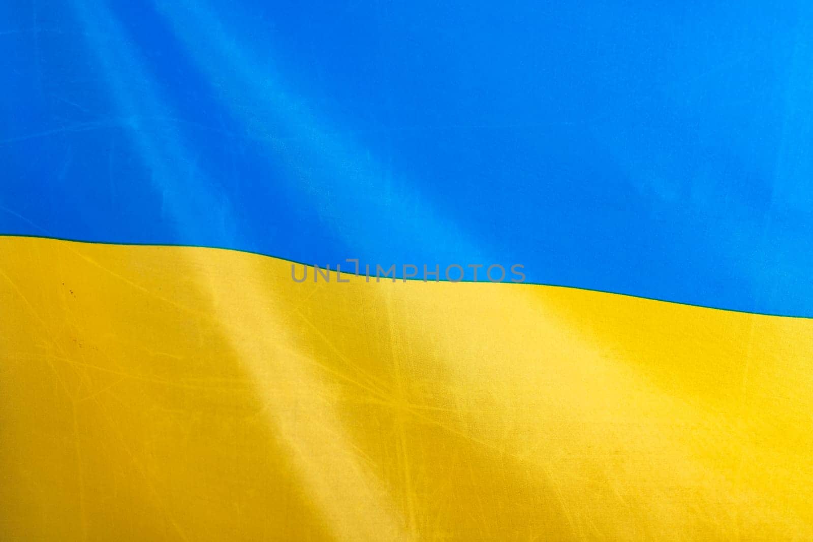 Flag of Ukraine, UA. Blue and yellow colors. Close up shot, background