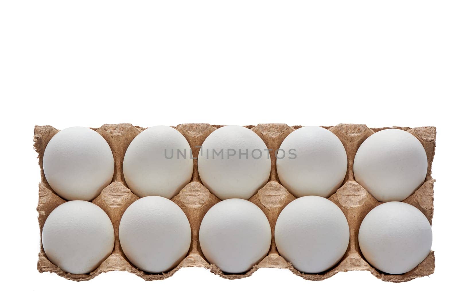 A dozen white eggs on a cardboard stand on a white isolated background. High quality photo