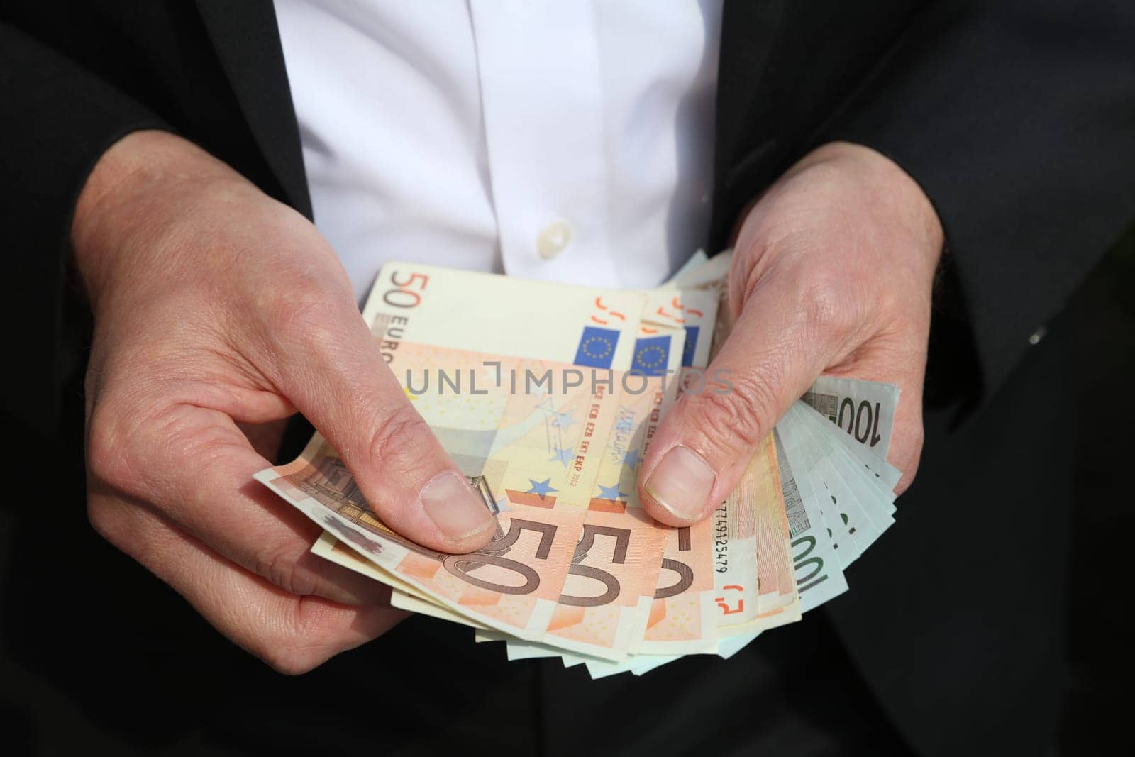 Businessman with Euro Banknotes