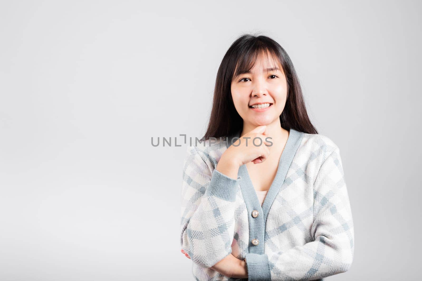 Happy woman hand touch chin handle relaxed thinking about something about the question, Portrait Asian beautiful young female idea think studio shot isolated on white background with copy space