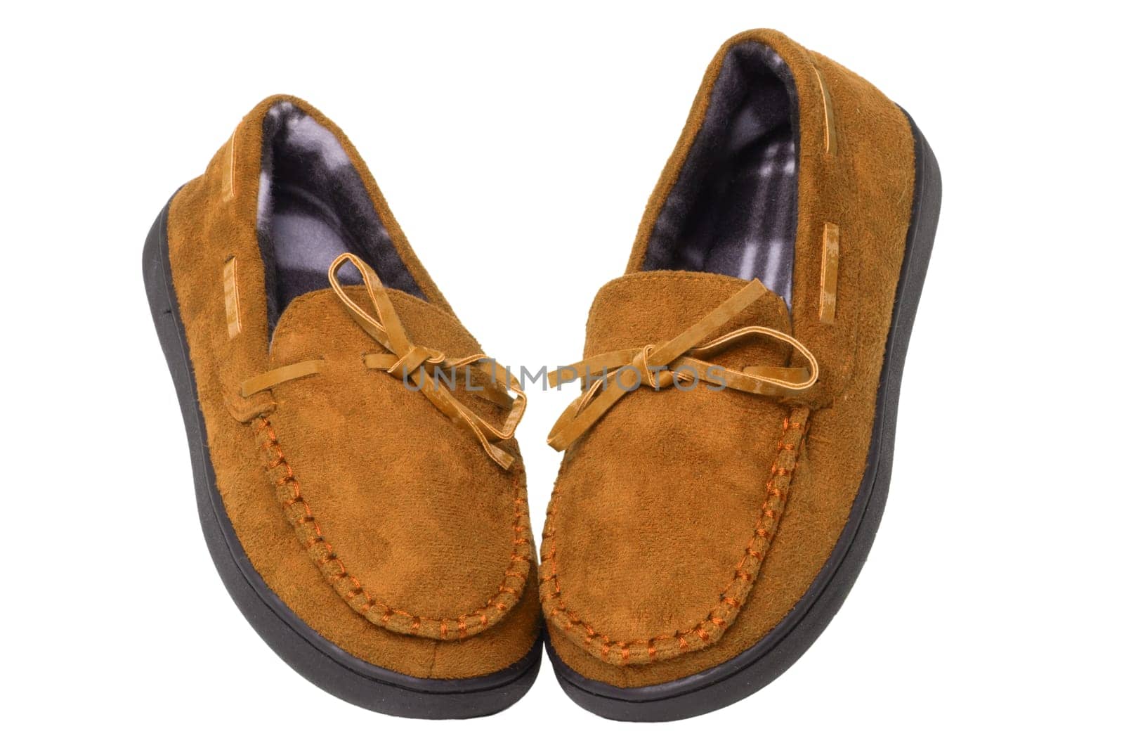 Slippers isolated. Close-up of a pair of female brown and soft cosy terry house slippers isolated on white background.  Womans shoes. Macro.