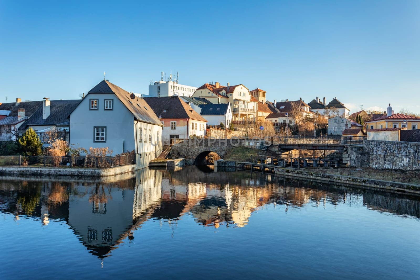 Old town in city Jindrichuv Hradec reflecting in water, Czech Republic in the region South Bohemia.