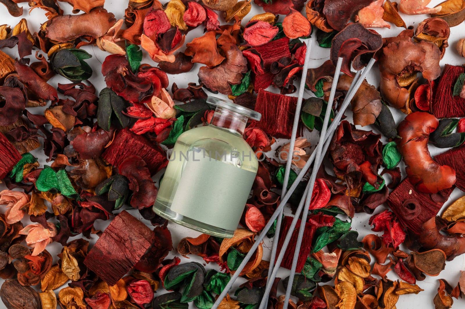 Home aroma fragrance diffuser on dry flowers background