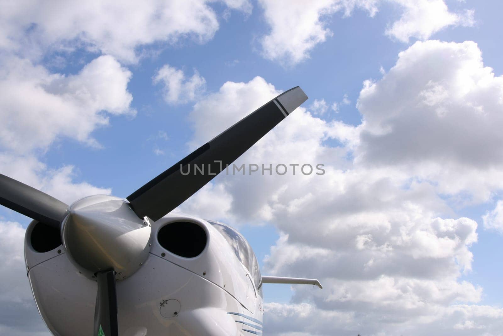 The airplane propeller against cloudy sky