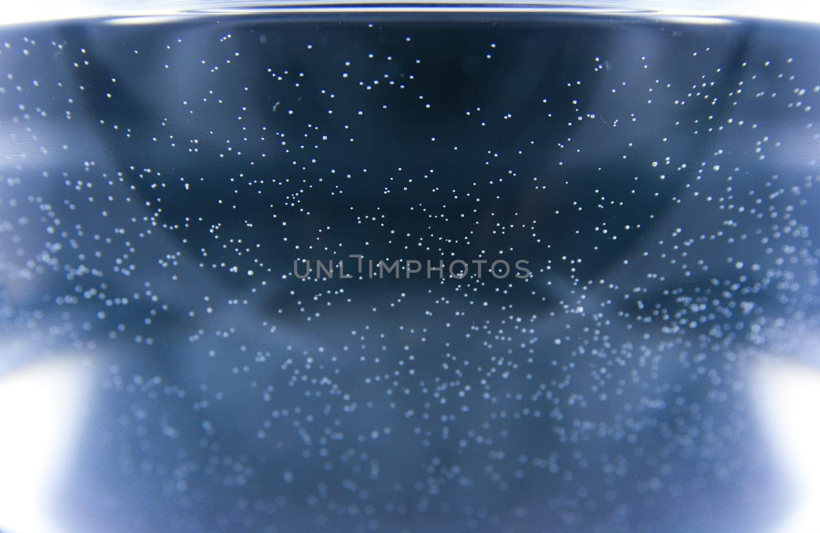 The blue background with small white sparkles