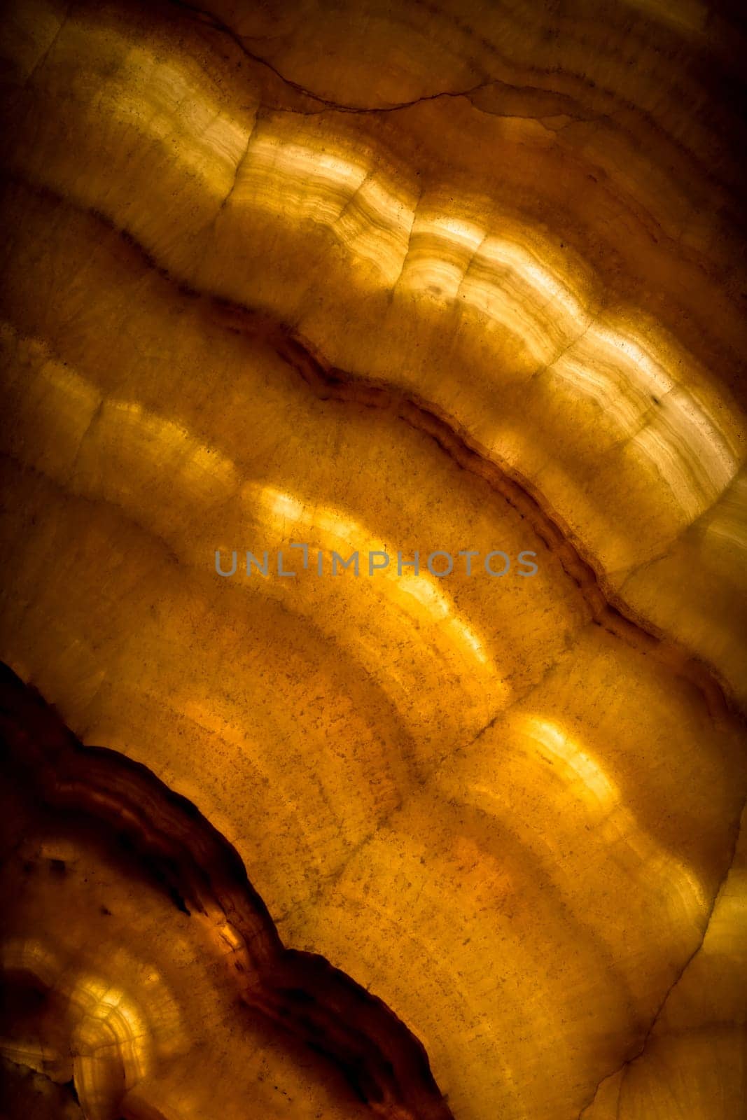 Architectural detail of an antique alabaster stone sheet. Alabaster is translucent enough to be used for small windows. It was used for this purpose in Byzantine churches. Image useful for an elegant background.