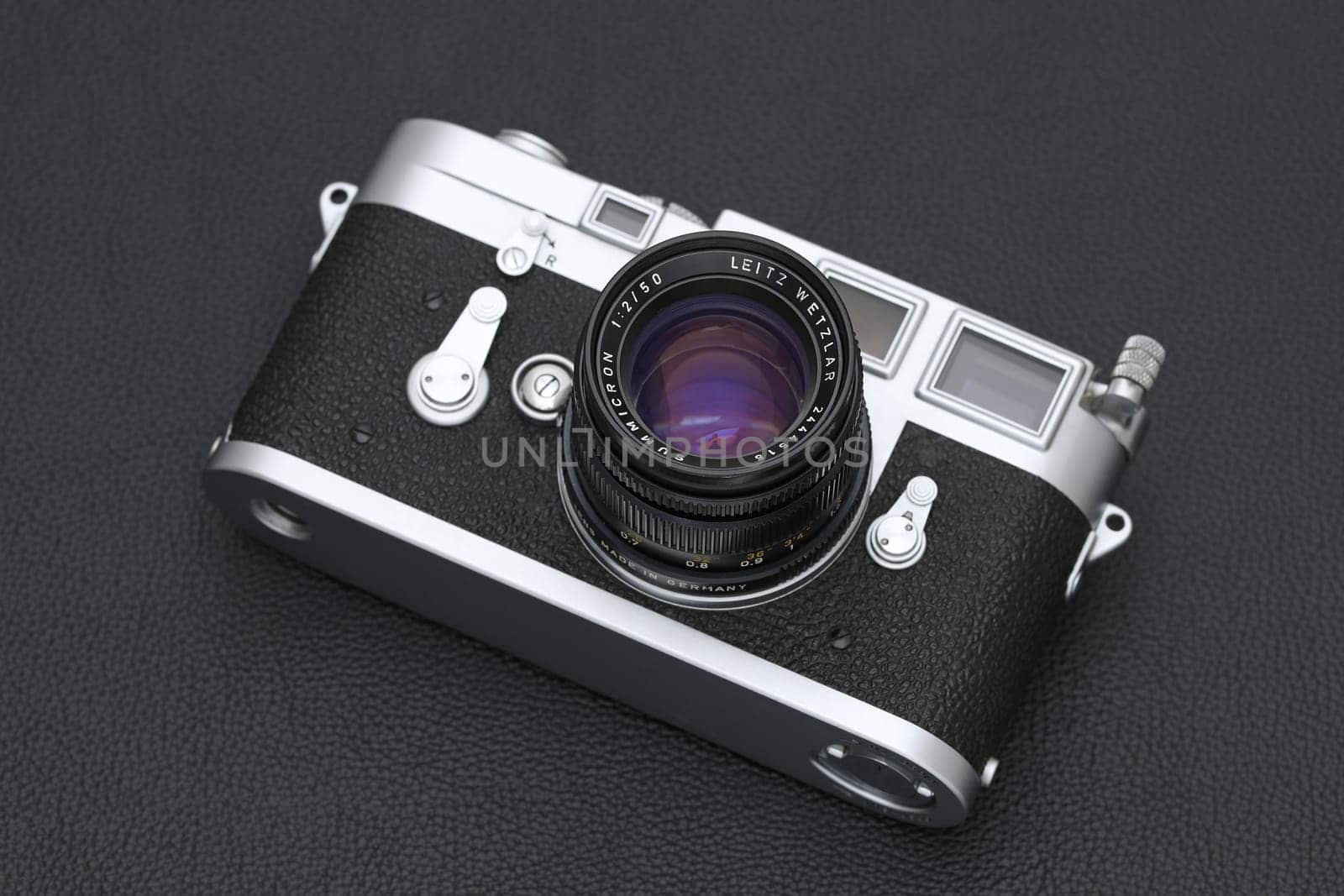 Kagawa, Japan - February 27, 2022: Leica M3 rangefinder camera with Leitz 50mm f2 Summicron M-mount lens. Vintage collectible classic lens concept.