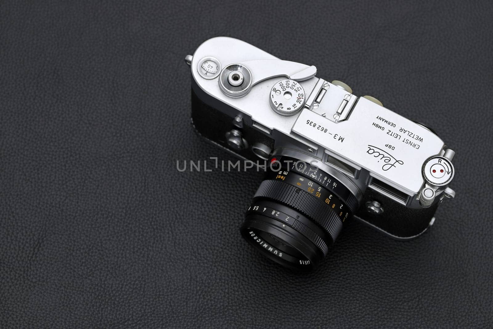 Kagawa, Japan - February 27, 2022: Leica M3 rangefinder camera with Leitz 50mm f2 Summicron M-mount lens. Vintage collectible classic lens concept.