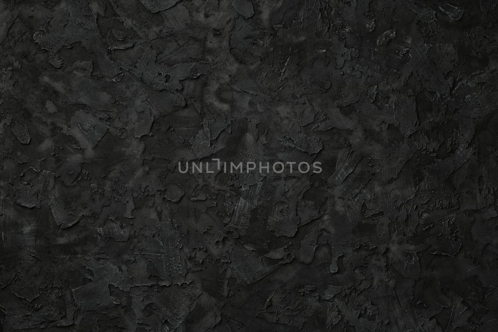 Black stucco texture. Black stone background. Copy space for text. Flat lay.