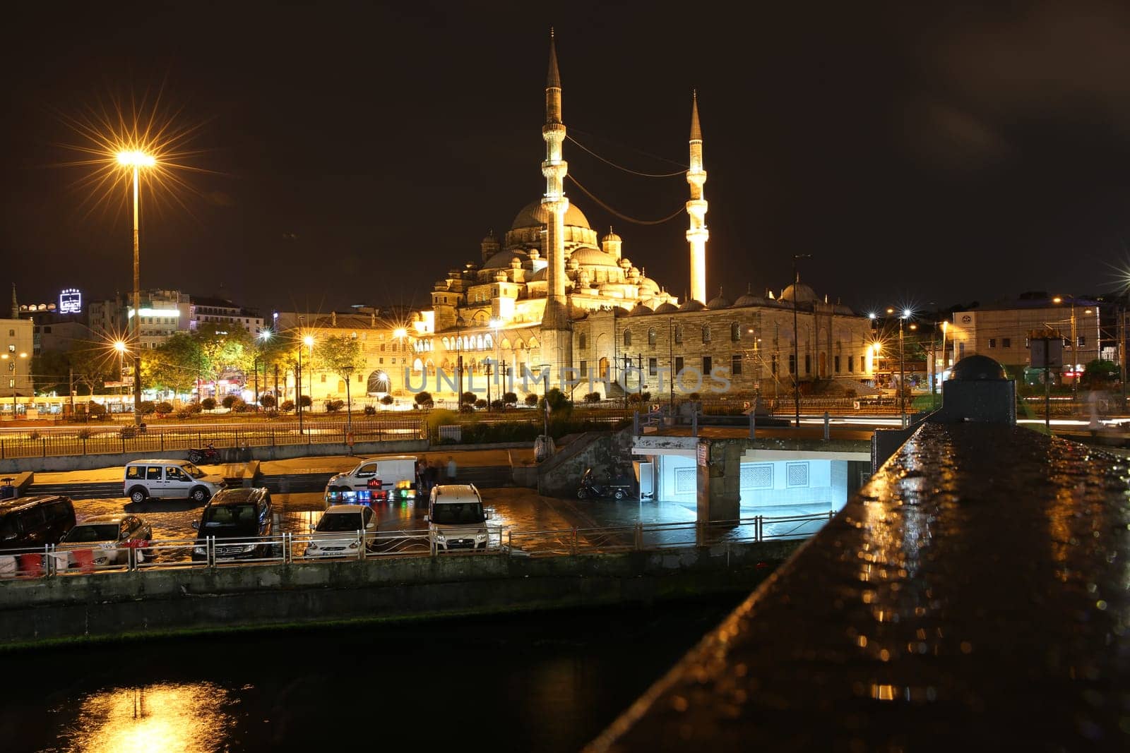 View from Galata Bridge to New Mosque called Yeni Cami Mosque in Istanbul by Night. Turkey