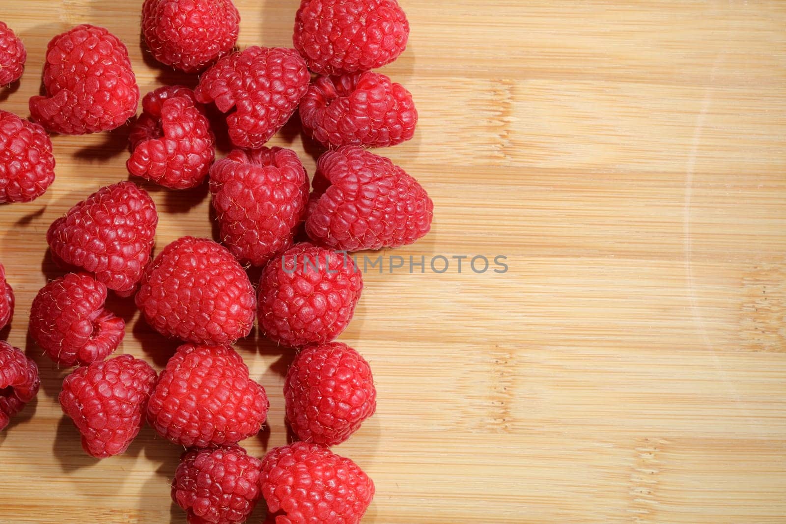 Raspberries on Cutting Board