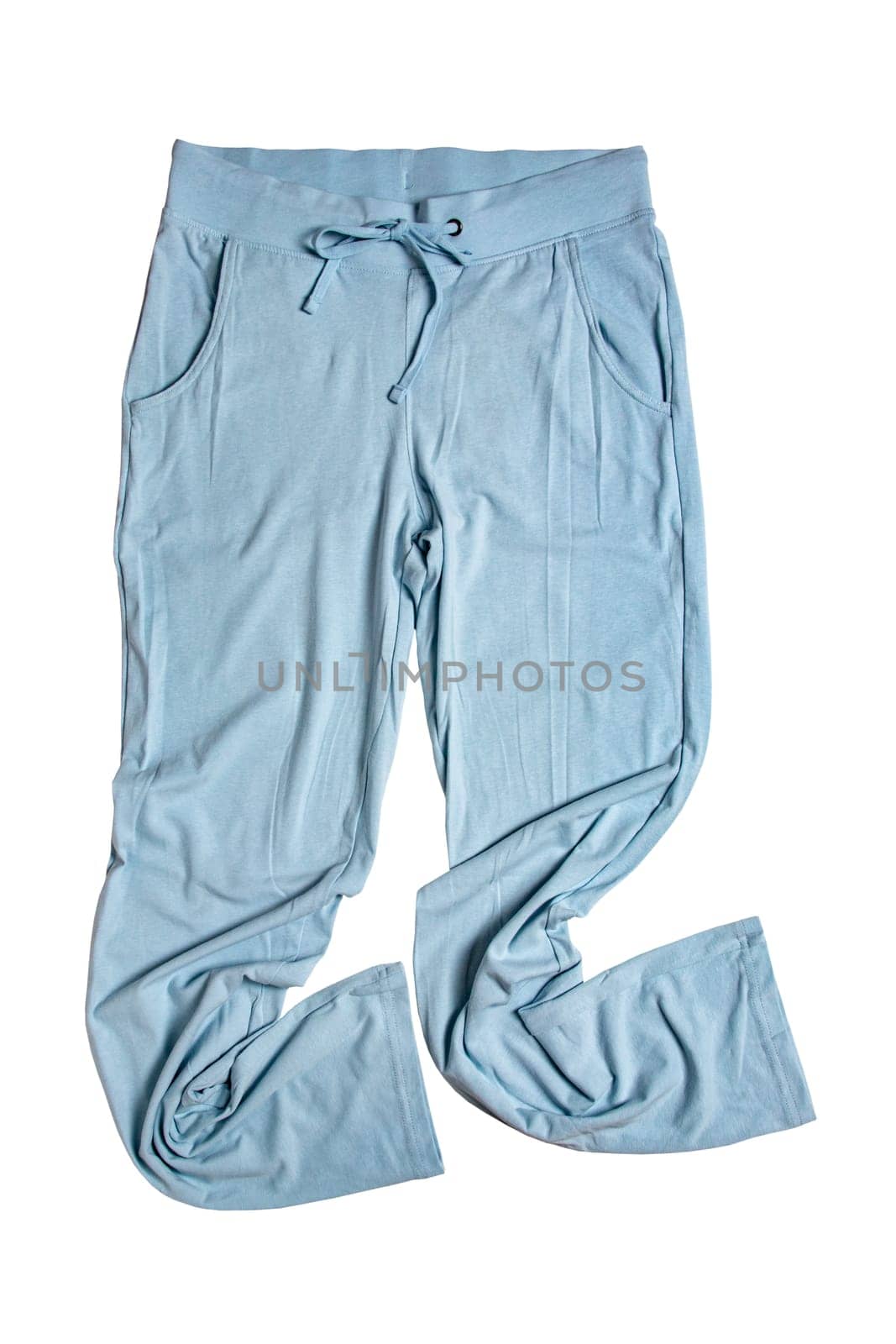 Sweat pants isolated. Close-up of womans fashionable blue casual trousers or jersey trousers isolated on a white background. Jogging outfit for workout. Clipping path.