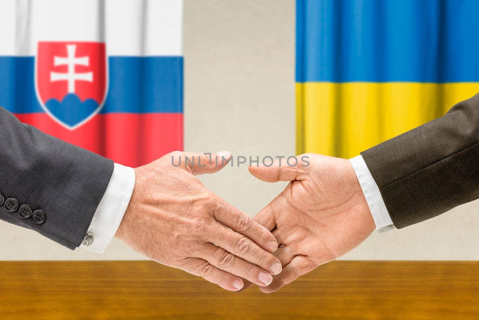 Representatives of Slovakia and Ukraine shake hands