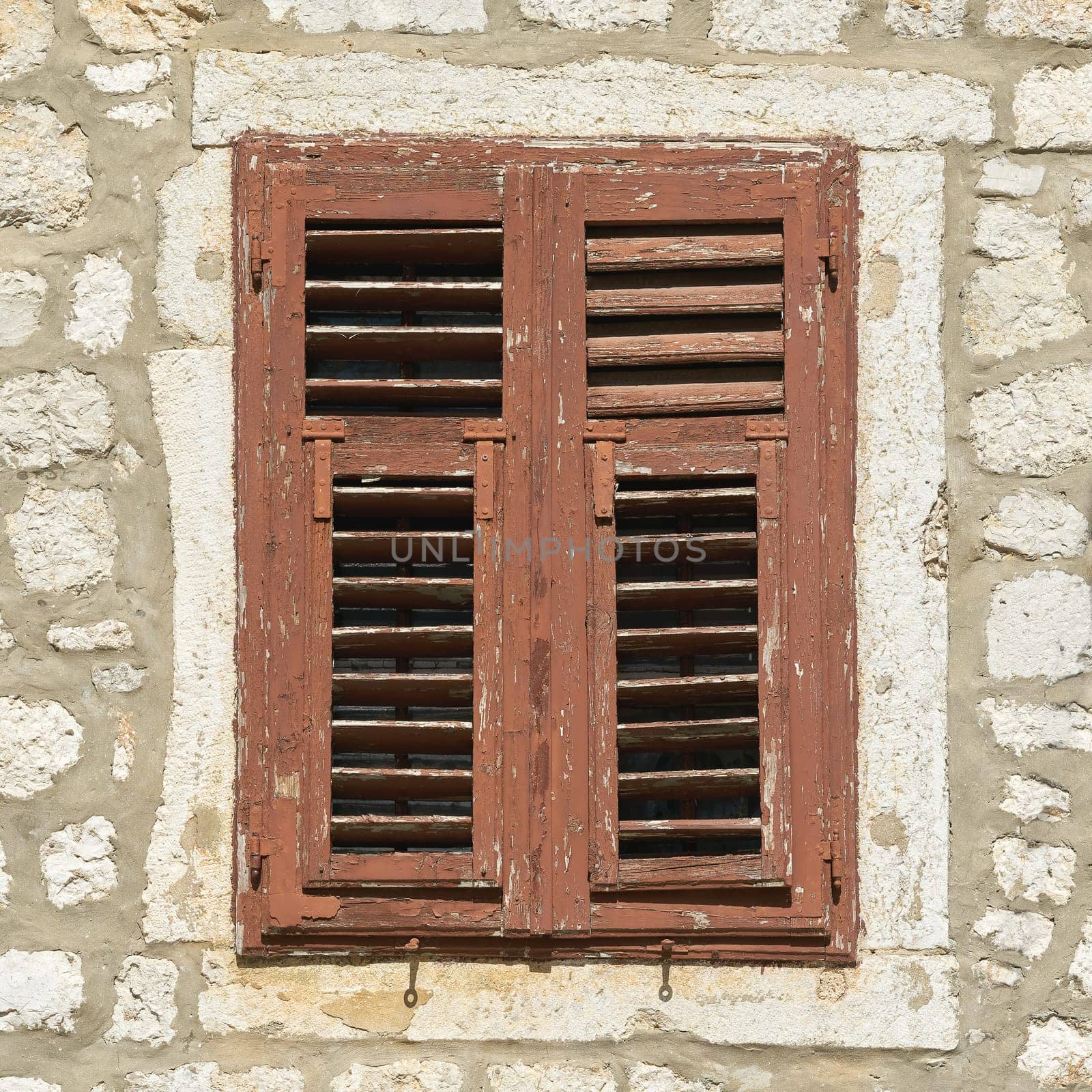 Window with shutter in the historical old town of Krk in Croatia