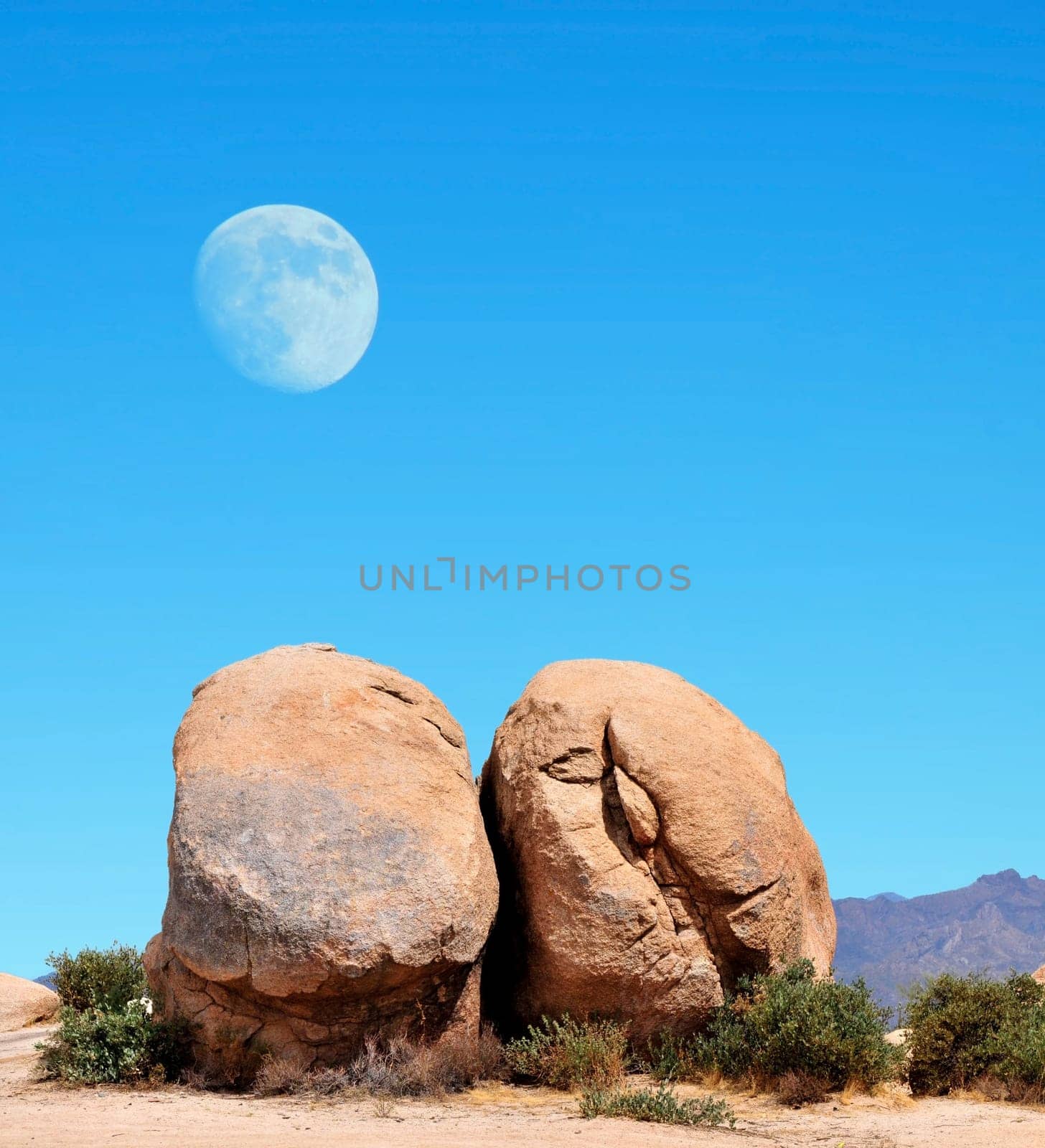 Desert moon over the southwestern USA desert and mountains