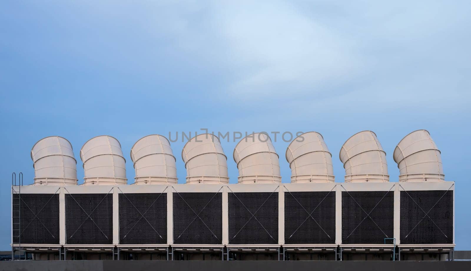 Industrial cooling towers or air cooled chillers on building rooftop