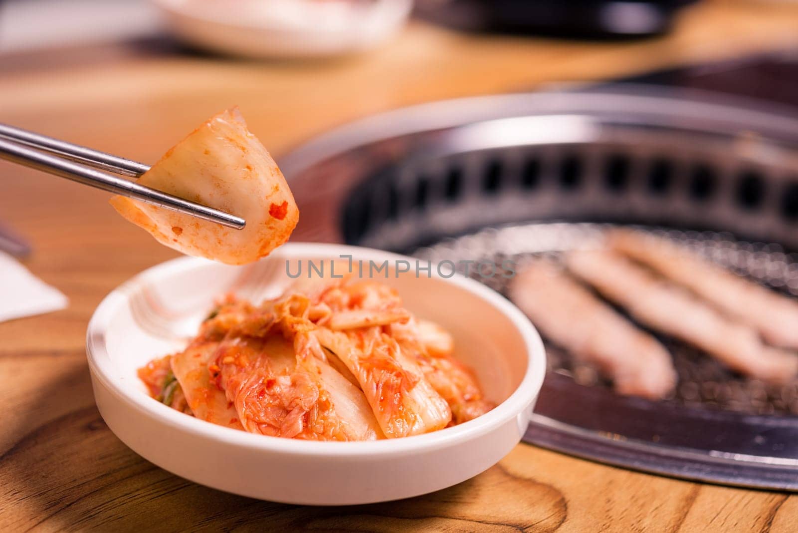 Spicy Kimchi group. Korean pickle or Pickled radish vegetables set and seasoning on bowl on stove serve wood table background, Japanese food