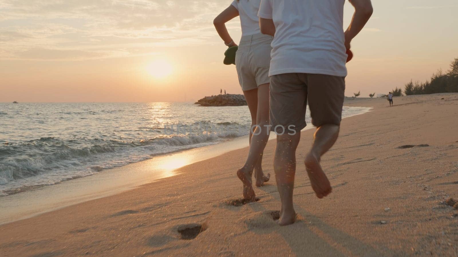 Vacation loving couple running on beach together at sunset landscape, relaxing vacation travel summer, Happy Asian man and woman in love honeymoon holding hands run along the sandy seashore