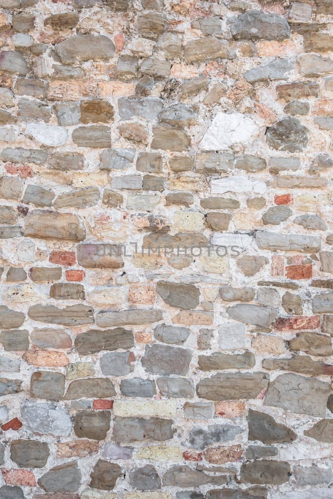 Antique natural stonewall. It can be used as texture and background.