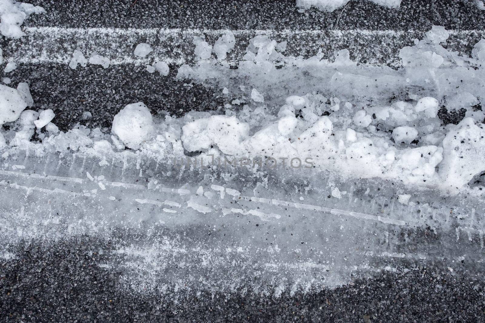 Car tire tracks in fresh snow