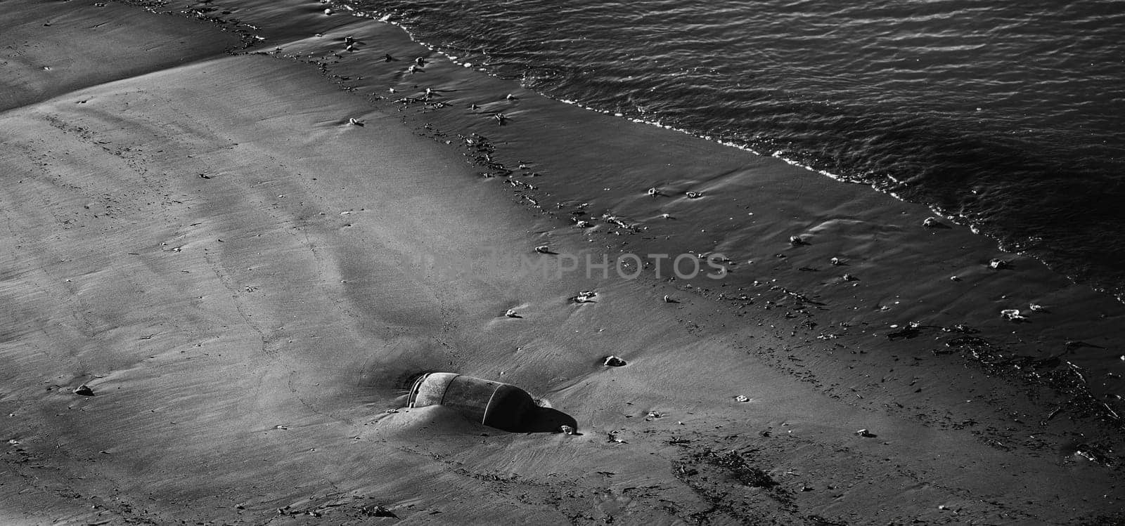 Oil drum on beach polluting, climate change, environment