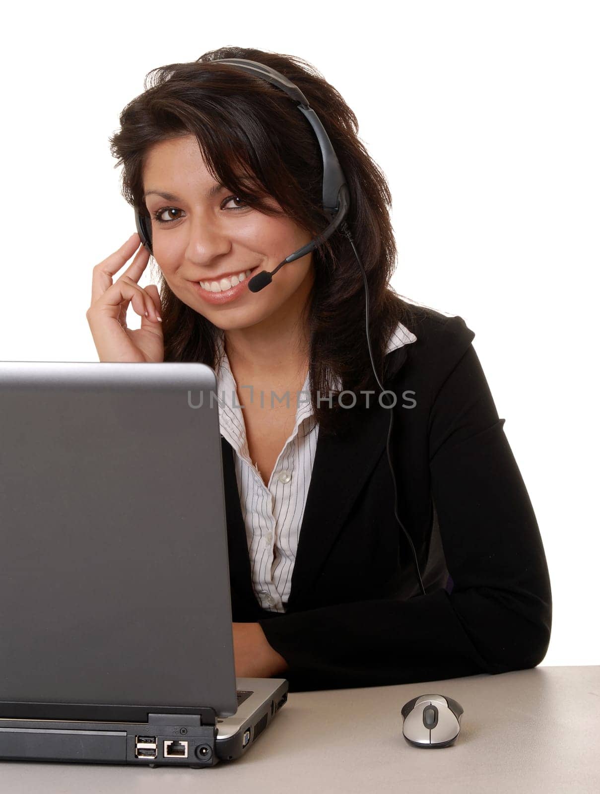 Lovely isolated latina business woman working hard wearing a headset microphone